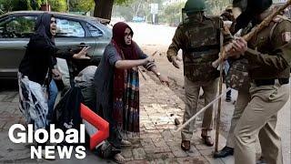 Women form human shield to fend off police beating during India citizenship law protests