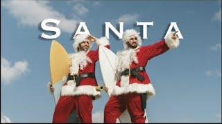 Surfing as Santa Claus in Venice Beach California