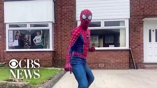 Martial arts teacher dresses up as Spider-Man to entertain children stuck indoors