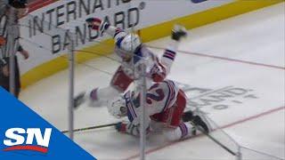 Chris Kreider Takes A Flying Knee To The Head As Mika Zibanejad Tries To Avoid Him