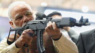 PM Narendra Modi visits DefExpo 2020, tries his hand at Gun