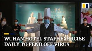 Hotel staff in Wuhan exercise daily to stave off coronavirus infection