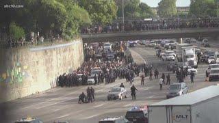 Protesters shut down I-5 in downtown Sacramento as they make their way to the freeway
