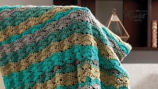 Left Hand: Crochet Wavy Caron Cakes Blanket Pattern