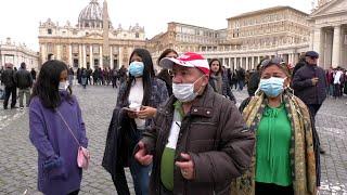 Masks and hand sanitizer mark tourists still traveling to Vatican