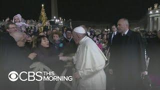 Pope Francis apologizes for slapping a woman's hand away after her rough grab