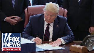 Trump signs $2 trillion coronavirus stimulus bill