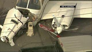 Small plane hits cars, crash-lands on street