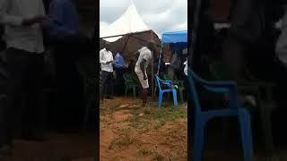 A man makes funny moves in a funeral