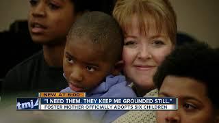 Mom adopts six boys after years of fostering