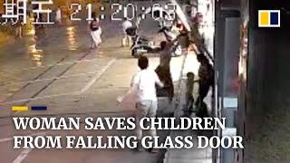 Woman saves children from falling glass door with her body in China