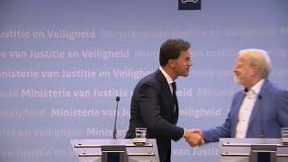 Watch: Dutch PM Rutte bans handshaking and then... shakes hands