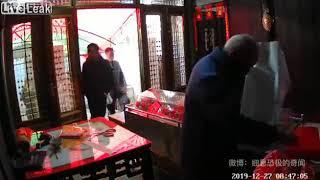 Dead father slapped and yanked out of coffin (China)