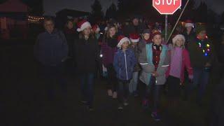 Students surprise teacher with Christmas carols