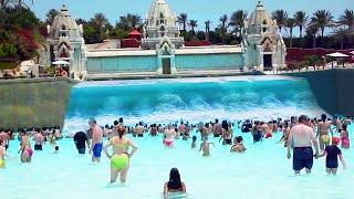 wave pool breaks and causes huge wave..