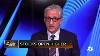 Stocks open higher on strong earnings, encouraging retail sales data