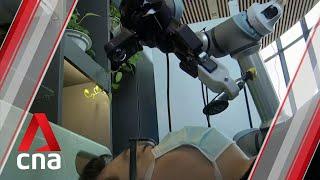 COVID-19: Chinese researchers design robotic arm that can take temperatures, mouth swabs