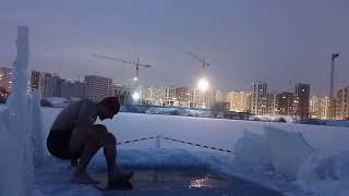 Top crazy russian guy breaks the ice and swim in ice water -24 degrees